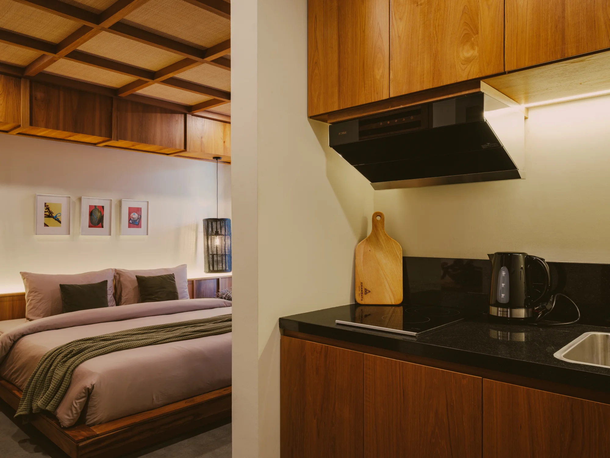 Functional kitchenette equipped with kettle, minibar and countertop