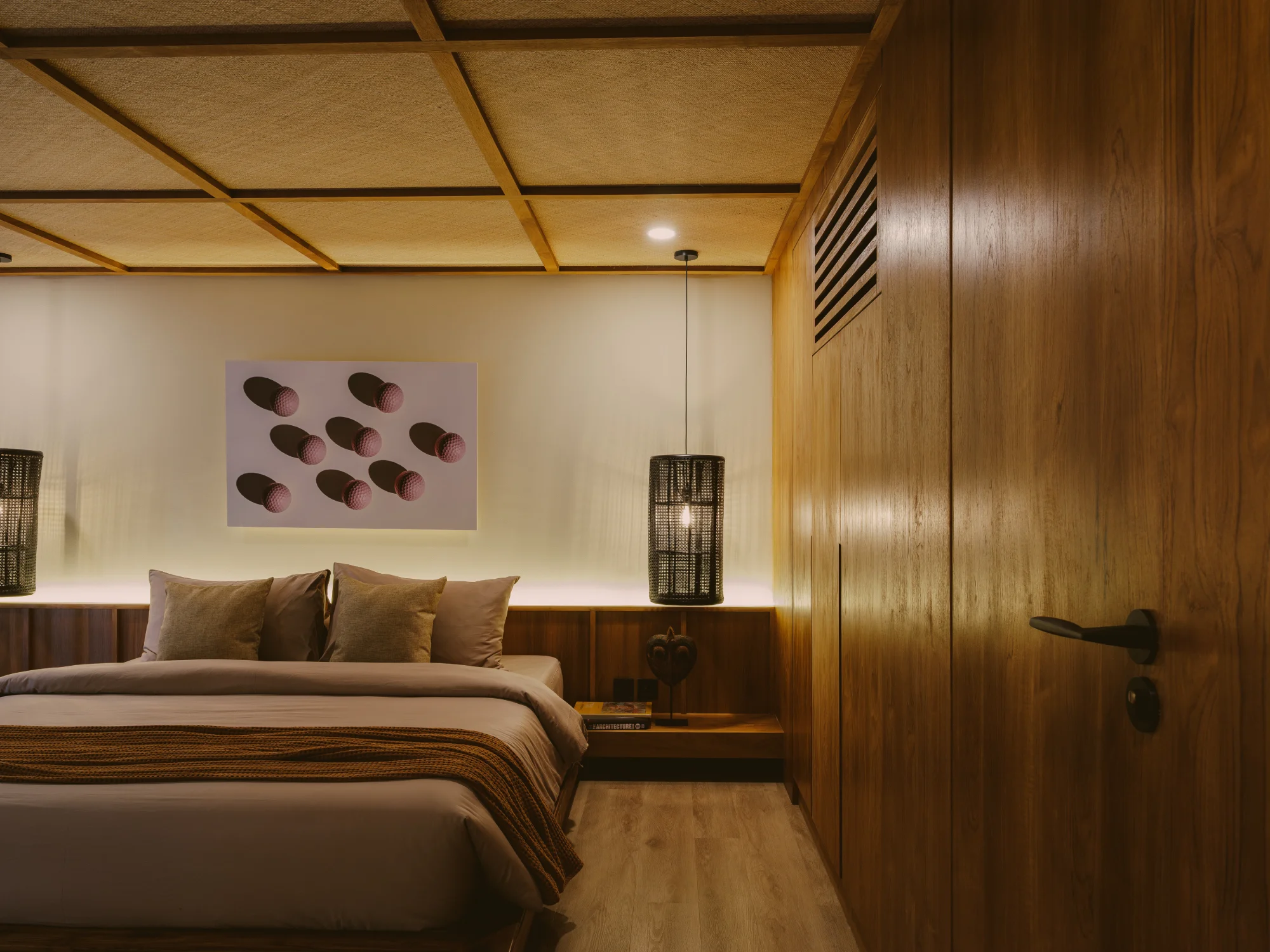 Deluxe mezzanine bedroom suite with king bed and timber ceiling