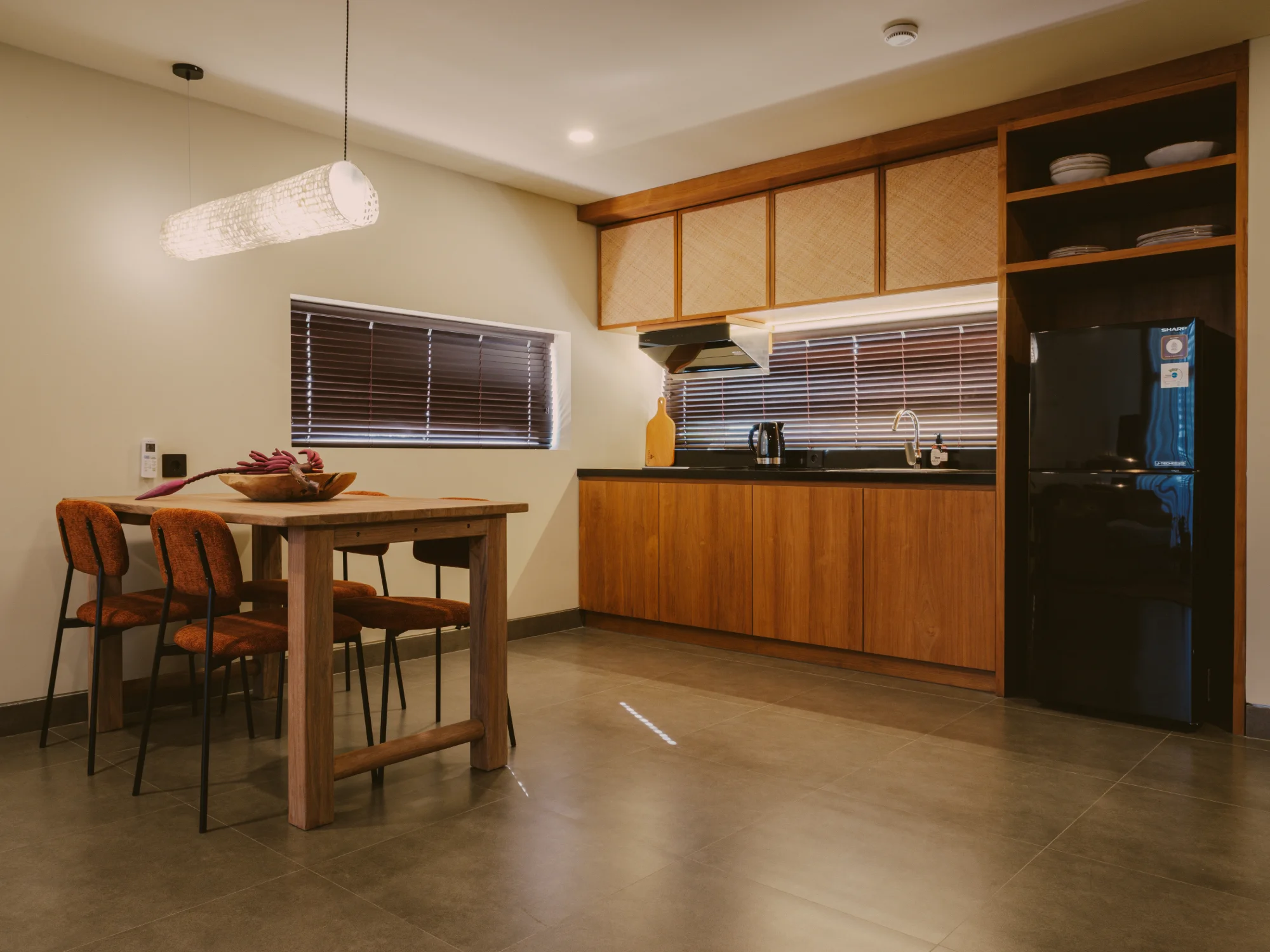 Full kitchenette with breakfast bar and modern appliances