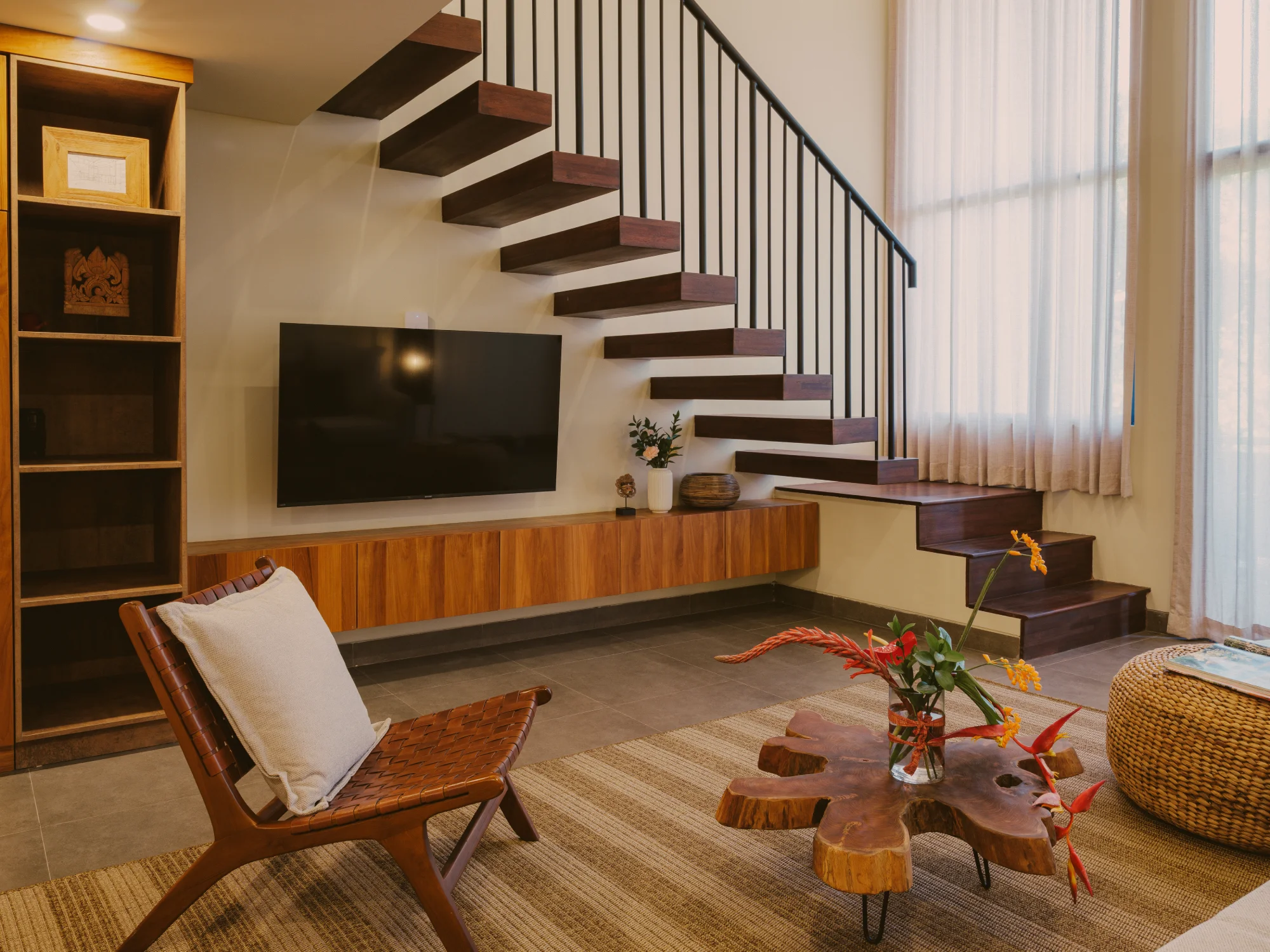 Sunlit living room with plush sofa and tranquil atmosphere